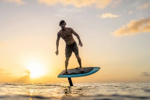 eFoil rider on the sea at sunset.