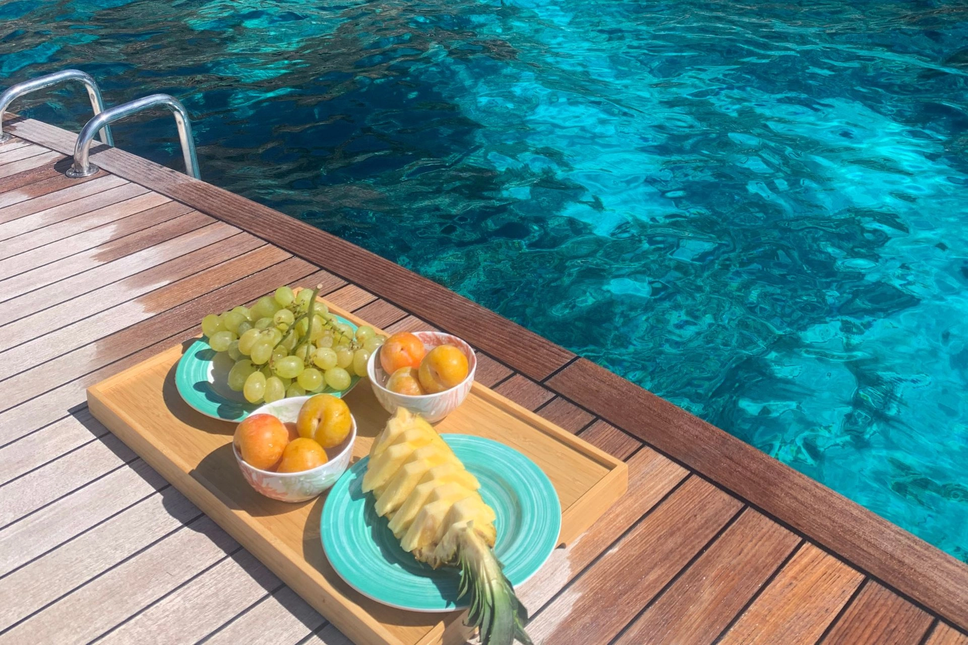 Charter yacht Fjord 36 Titan bathing platform with fruits.