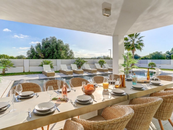 Exterior dining area of property Pollensa Sea View in Mallorca.