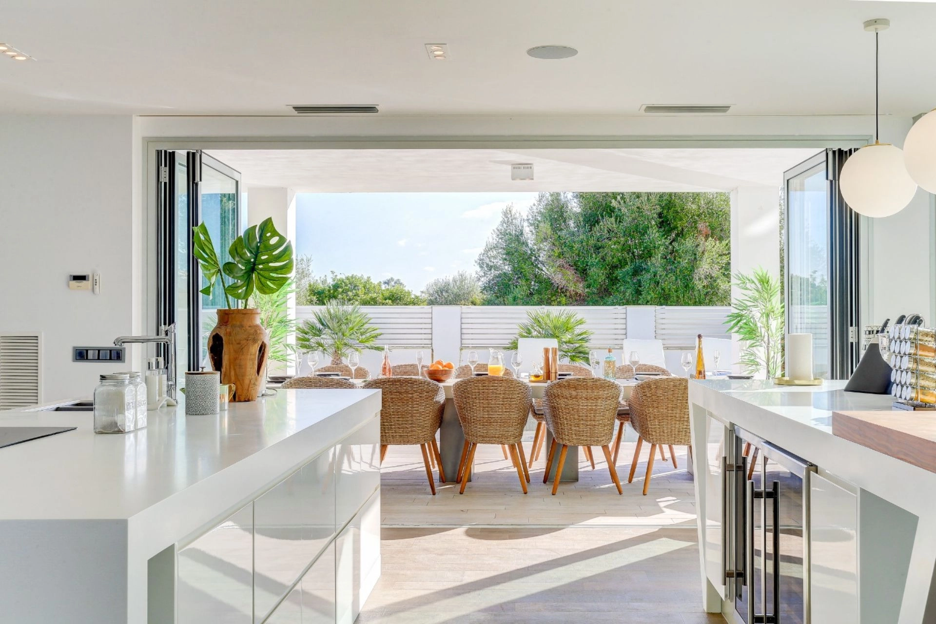 Kitchen and exterior dining area of property Pollensa Sea View in Mallorca.