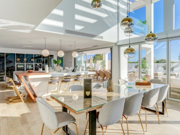 Salon and interior dining area of property Pollensa Sea View in Mallorca.