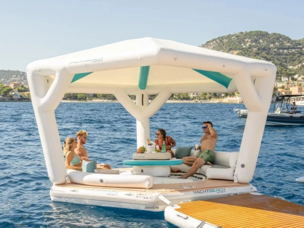 Yachtbeach inflatable platform on the sea with group of friends.