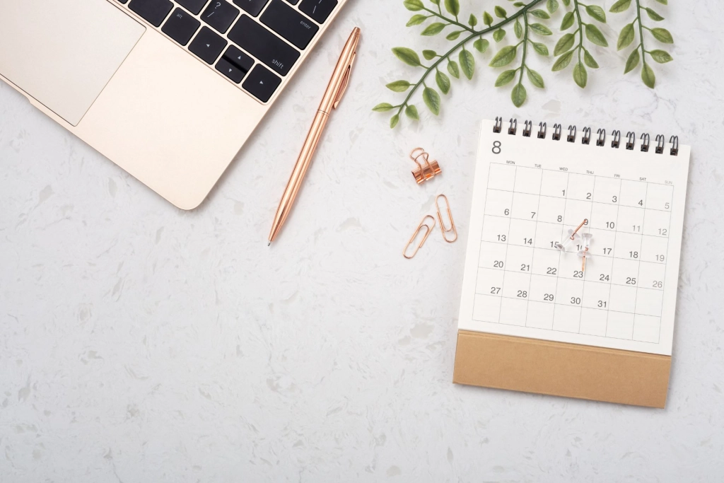 Calendar and laptop.