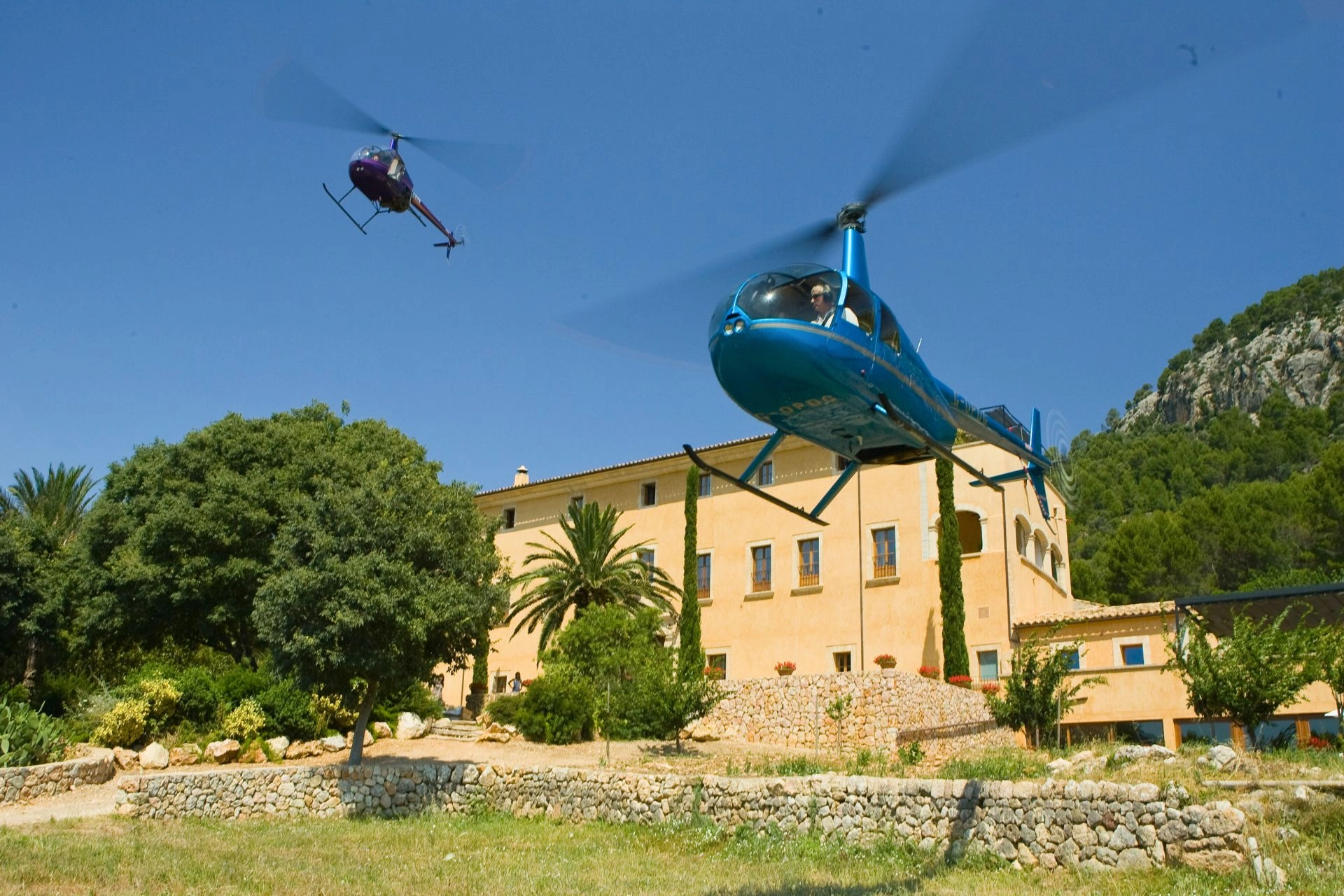 Helicopter landing at private finca in Mallorca.