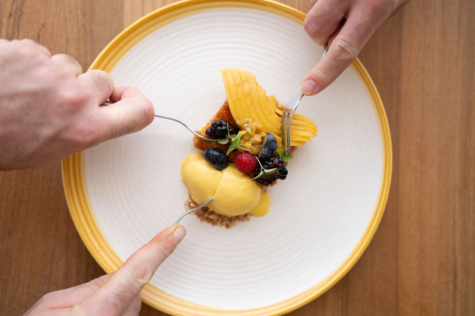 Sharing mouthwatering desert.