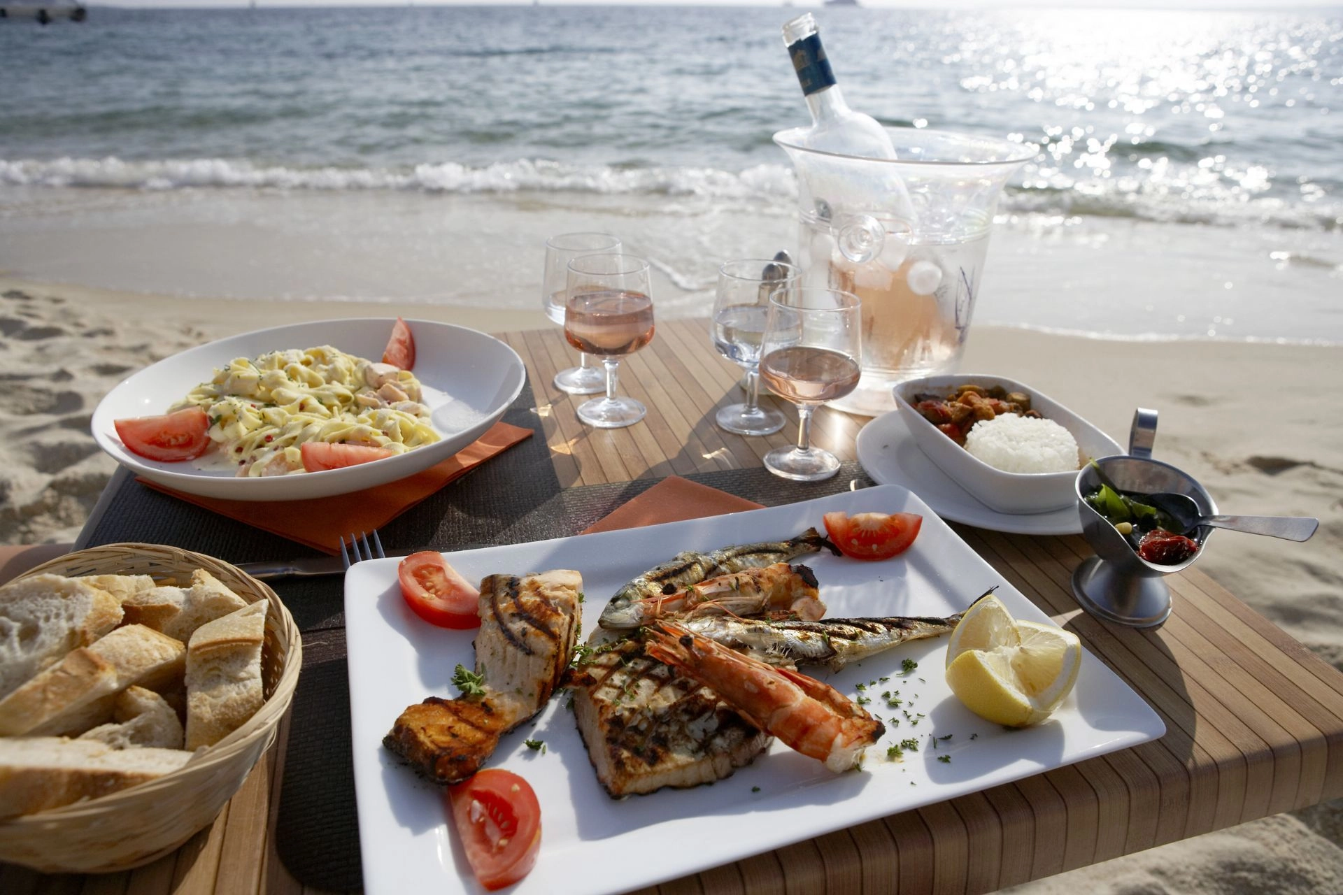Food and drinks at a beach front restaurant.