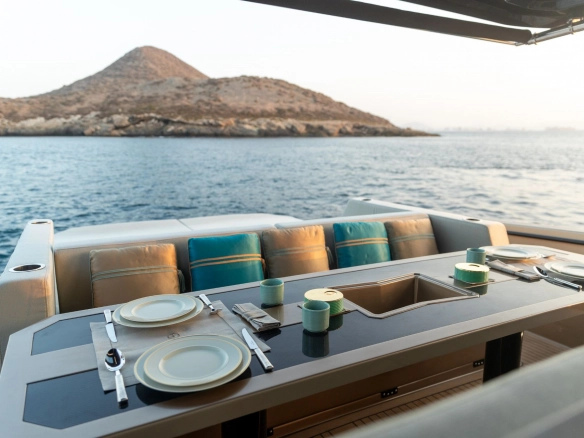 Charter yacht Tesoro T50 Speciale Goldfinger alfresco dining.