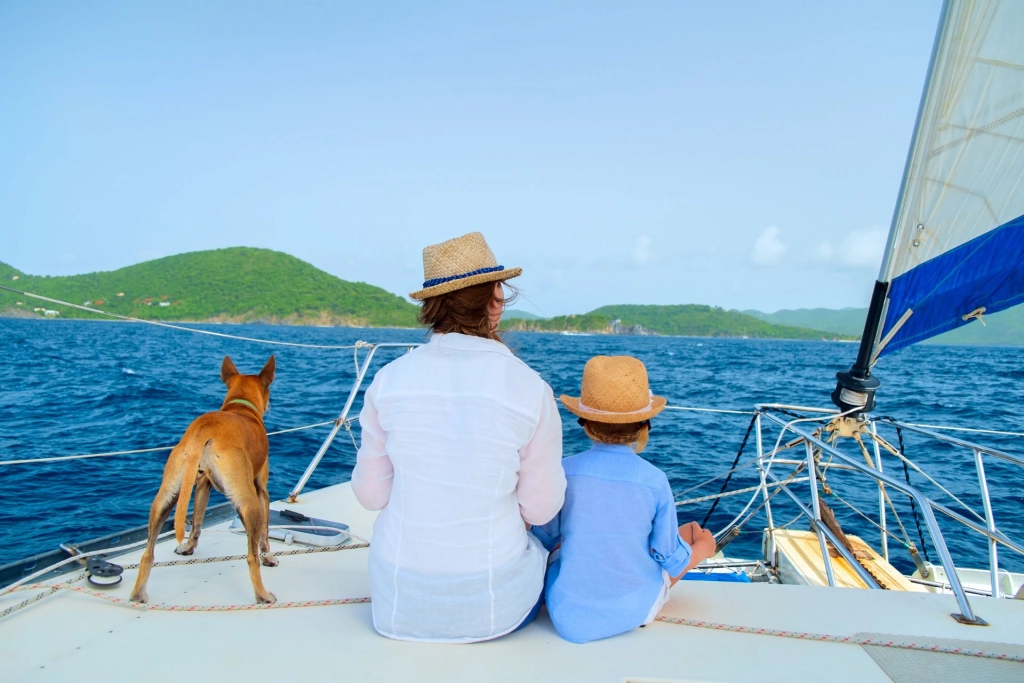 Mother, child and dog on a boat.