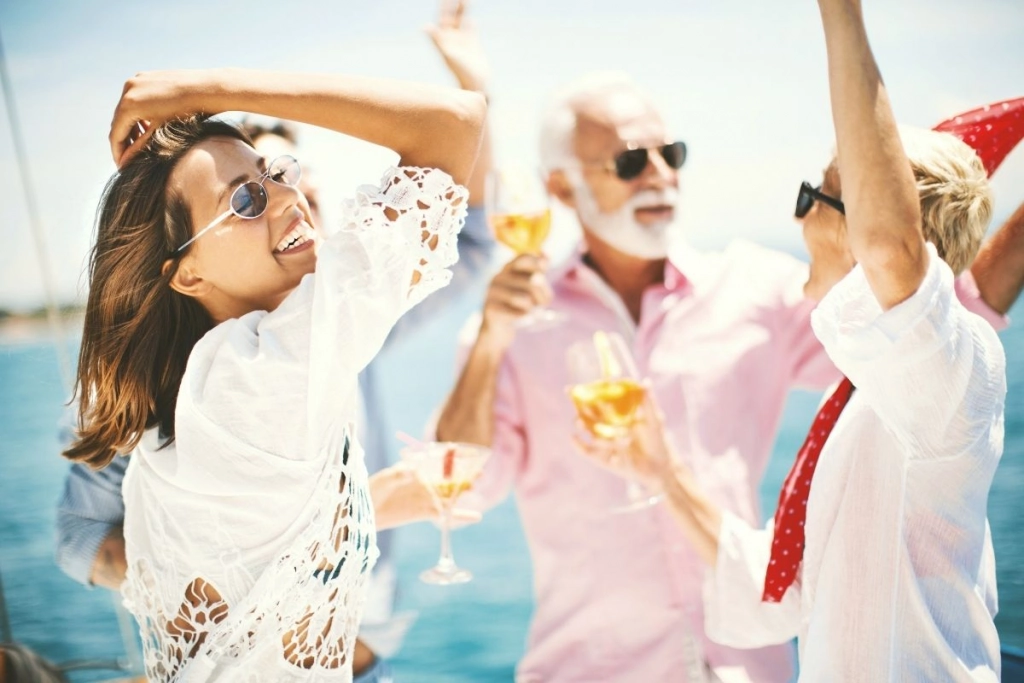 Family with champagne glasses on a yacht.
