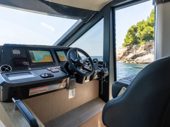 Helm of charter yacht Absolute 47 Fly Tres Amigos.