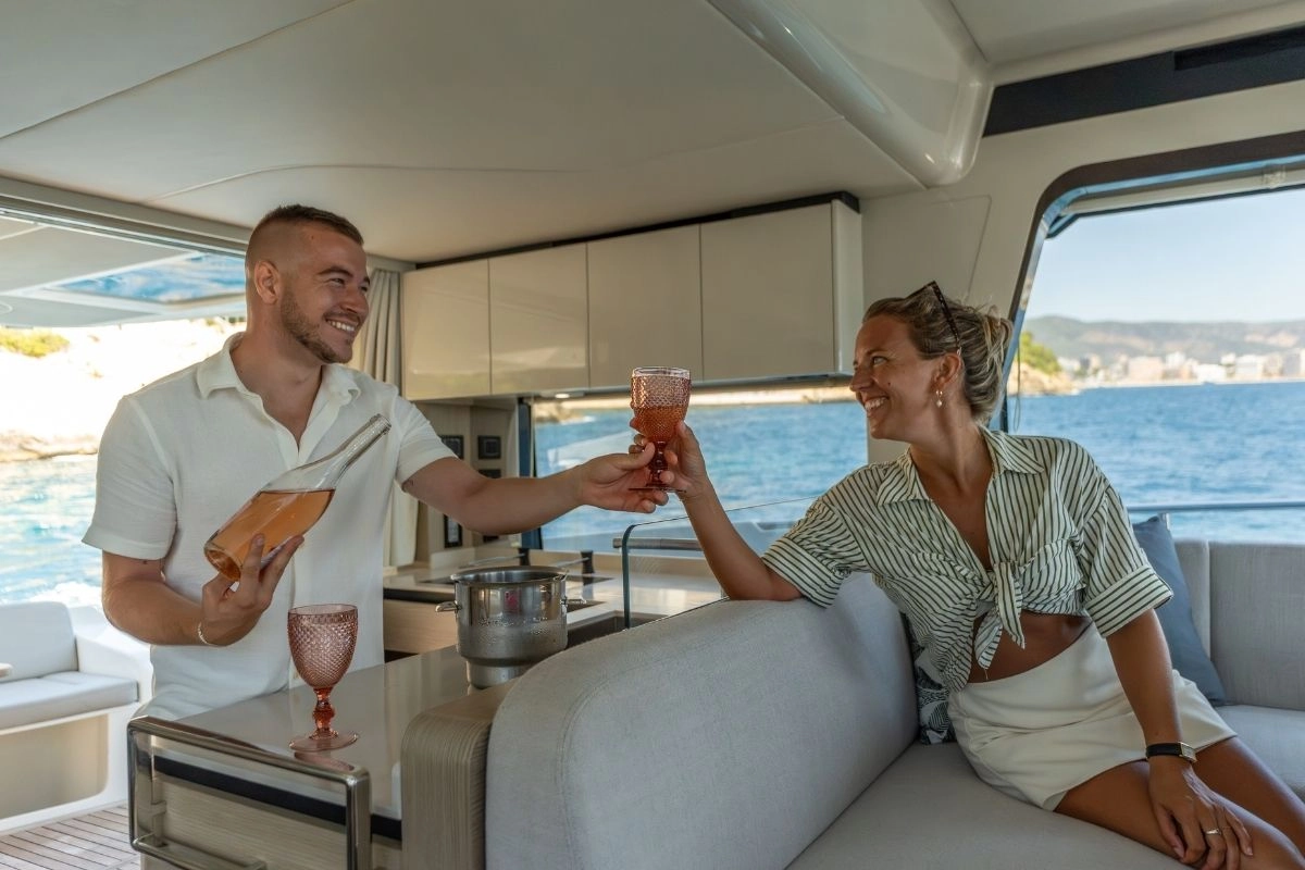 charter-yacht-absolute-47-fly-tres-amigos-service Couple on charter yacht Absolute 47 Fly Tres Amigos.