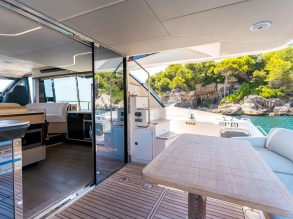 Stern dining area of charter yacht Absolute 47 Fly Tres Amigos.