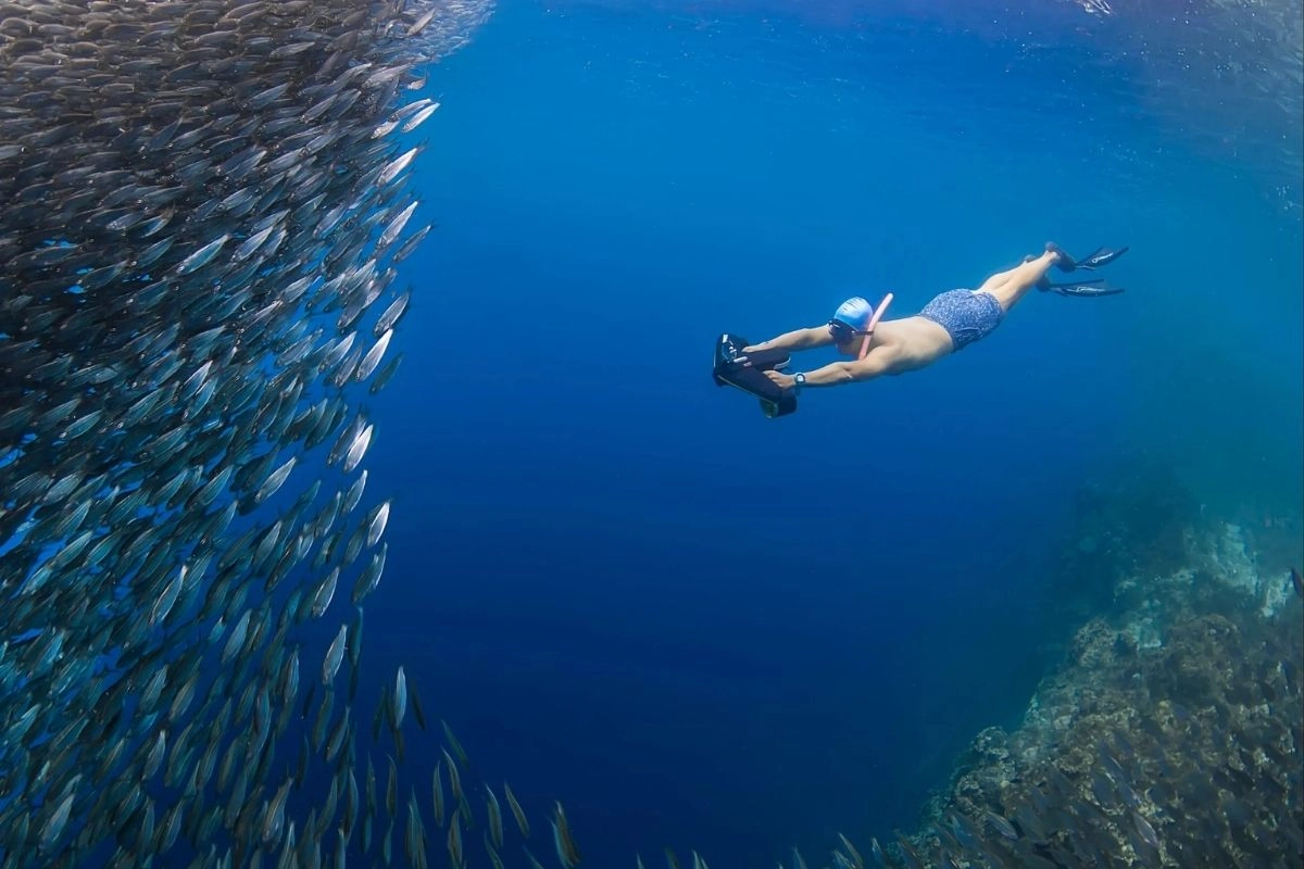 Boy diving with a Sublue