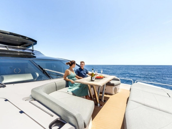 Couple on bow of Sunseeker 88 Junior