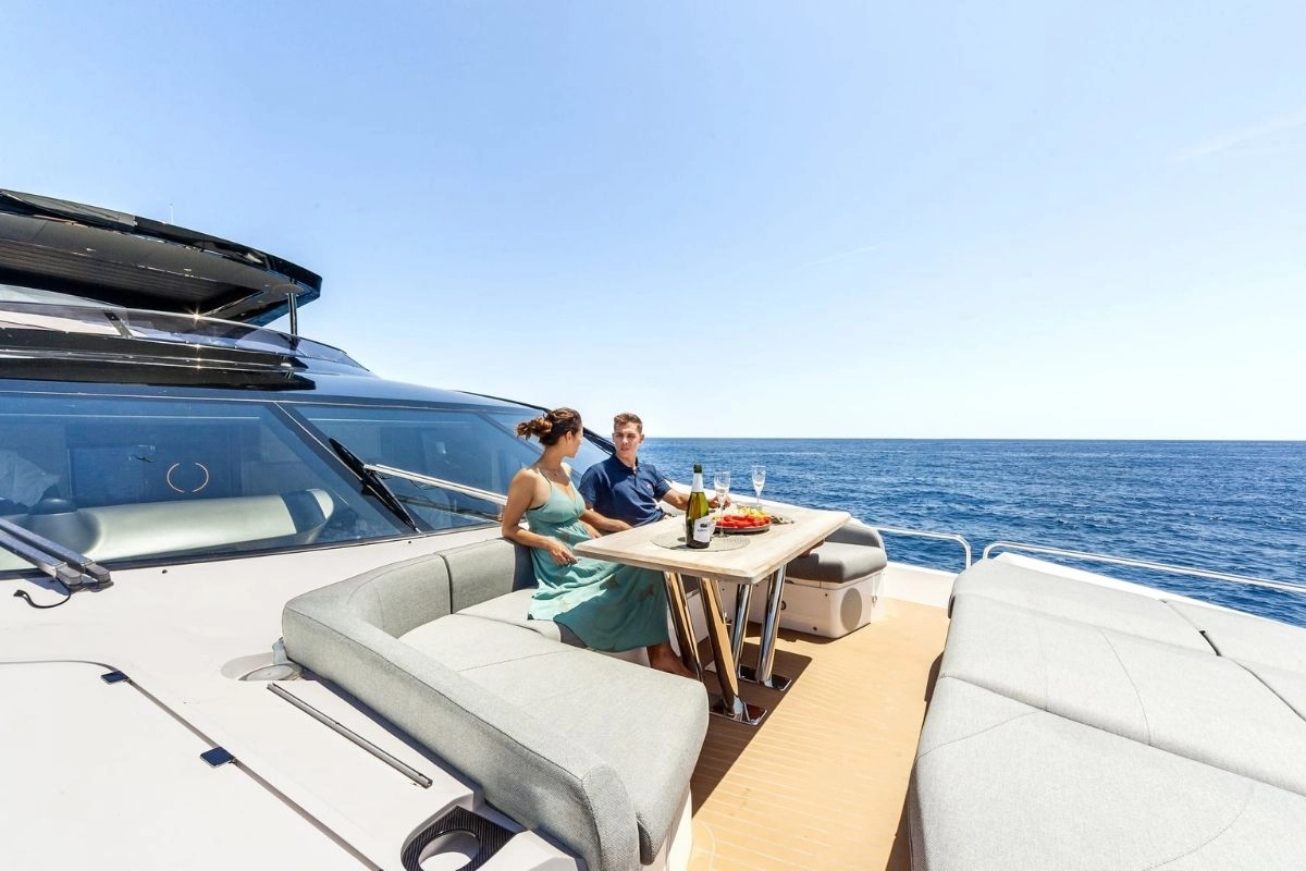Couple on bow of Sunseeker 88 Junior