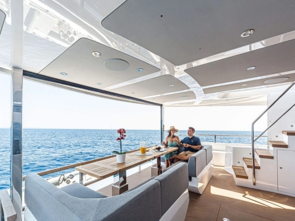 Couple on stern of Sunseeker 88 Junior