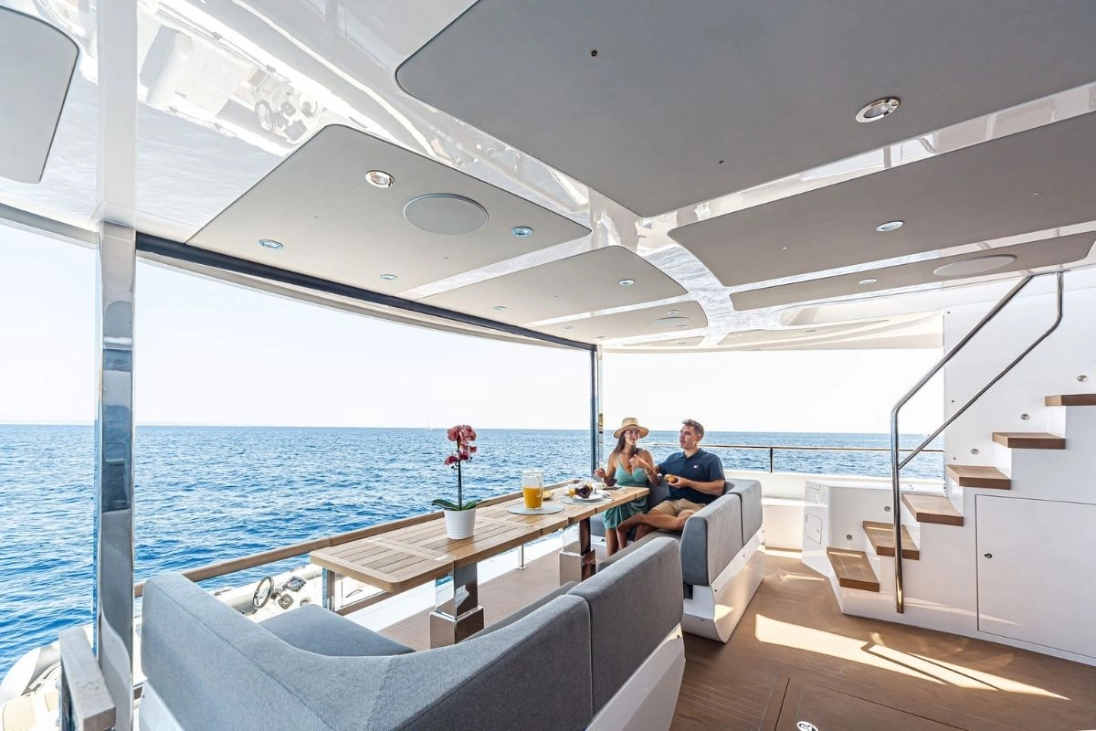Couple on stern of Sunseeker 88 Junior