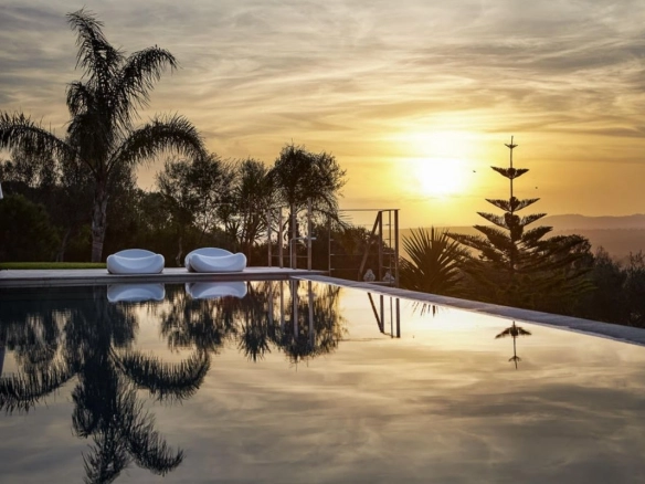 Pool at sunset of Villa Maravilles
