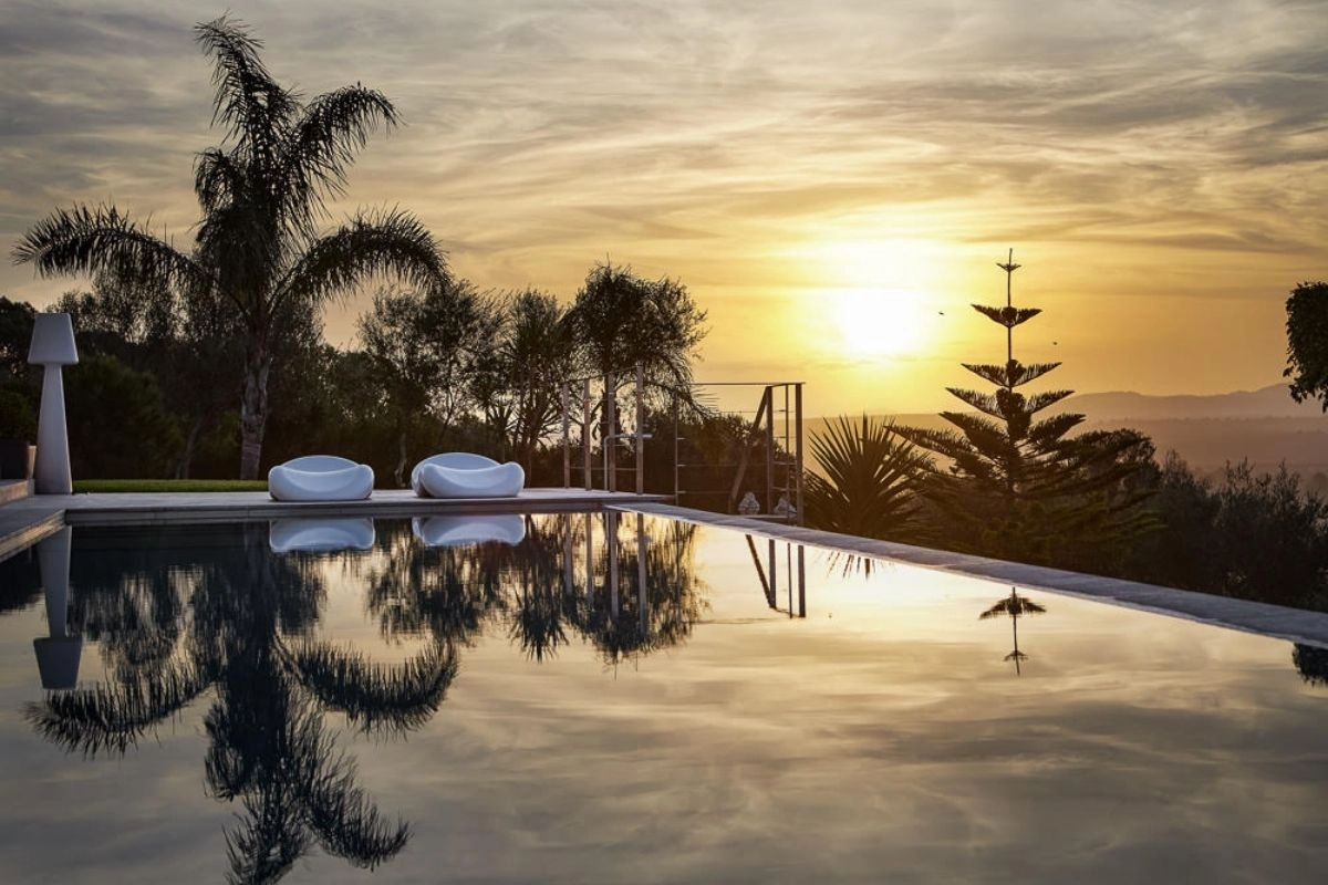 Pool at sunset of Villa Maravilles